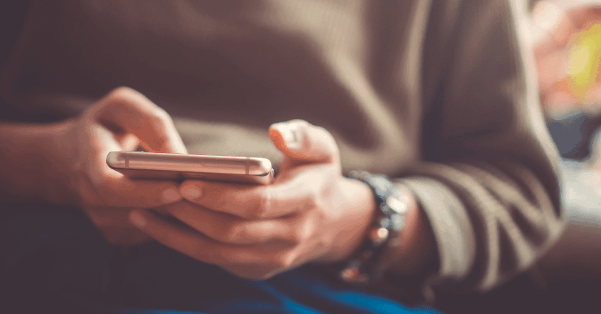 Man-Holding-Smartphone.png
