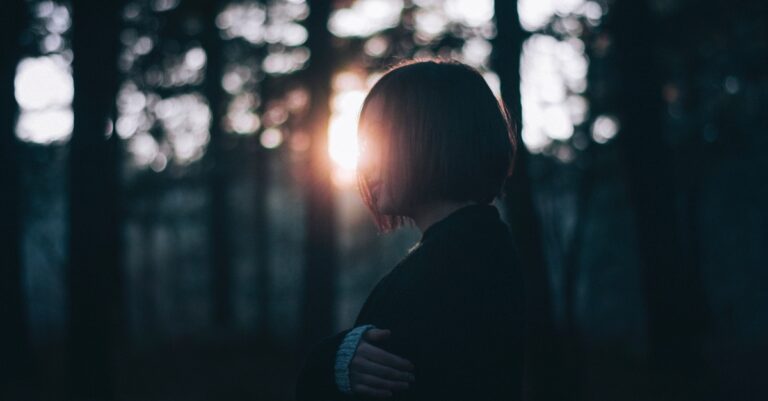 7513-woman-woods-dark-light-sunset-grief-riccardo-.jpg