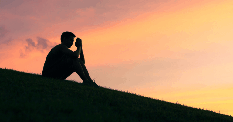 Man-Alone-In-Prayer-At-Sunrise.png