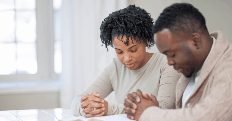 Couple-Praying-Together-With-Bible.png