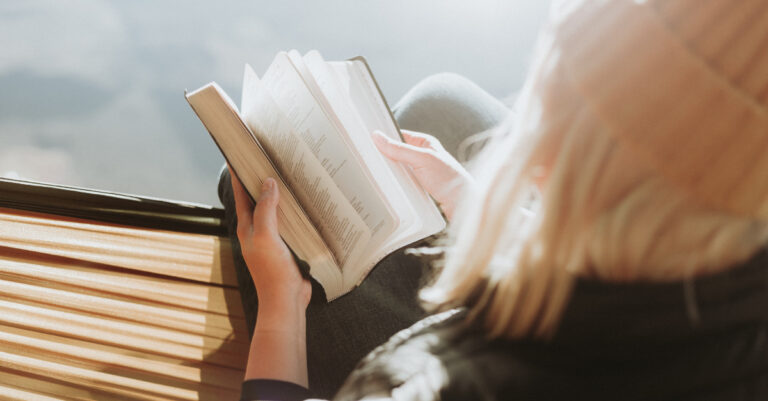 11315-back-view-of-young-woman-reading-bible-outdoo.jpg