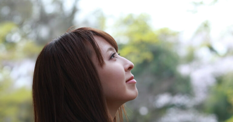 6282-asian-woman-looking-up-happy-peaceful-gettyim.jpg