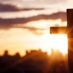 Cross-Steeple-on-Church-With-City-Skyline.png